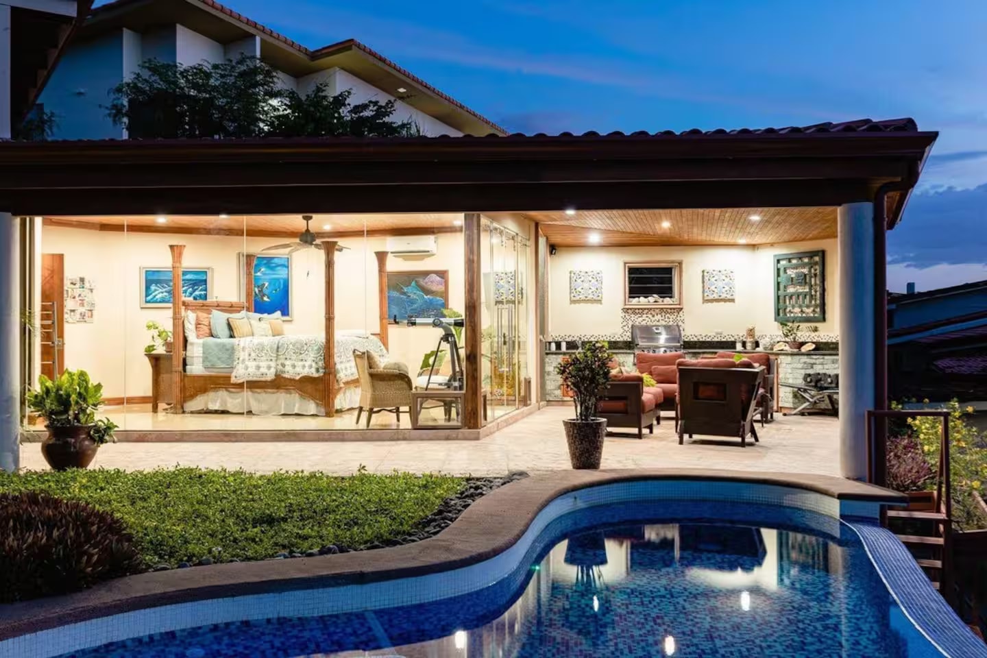 Villa Dos Playas pool at dusk with Pacific views